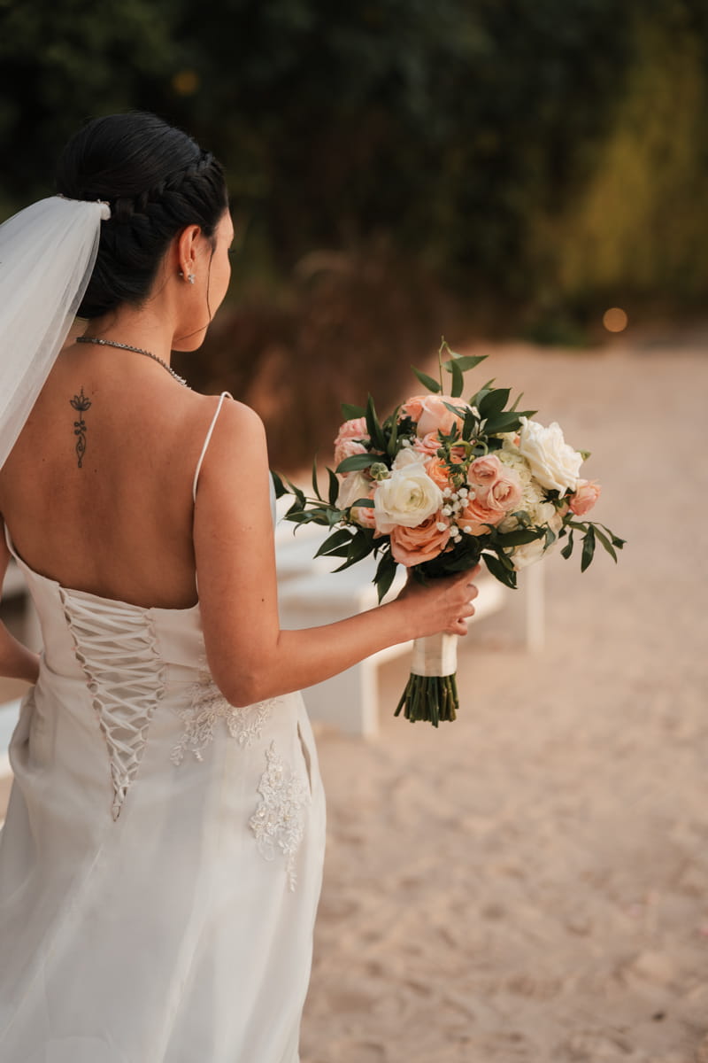 Bride holding her bouquet before the ceremony